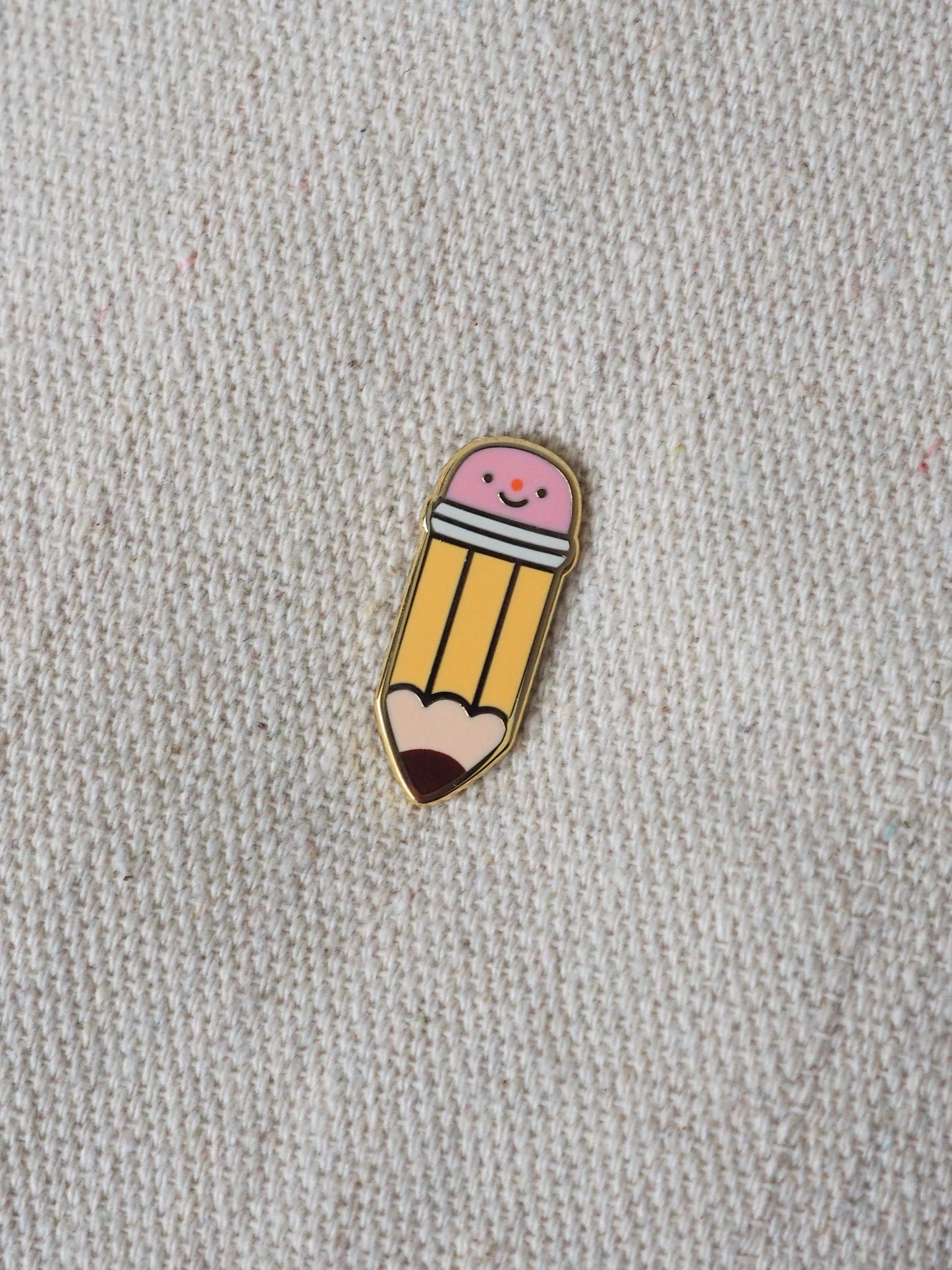 graphite pencil • enamel pin